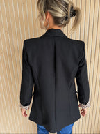 Blazer noir à revers de manches léopard
